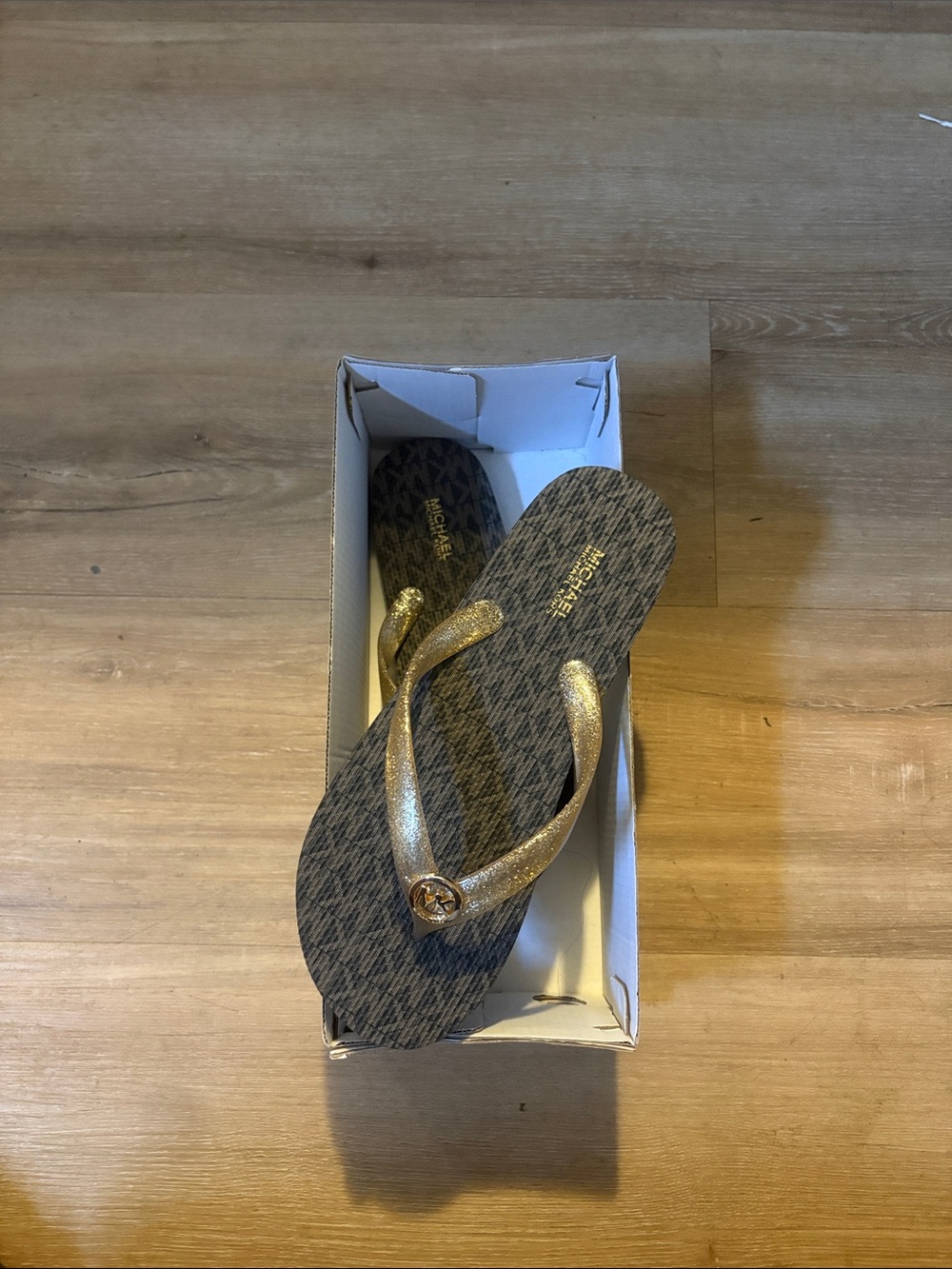 Michael Kors Gold Strap Flip Flop Sandals with Black Patterned Footbed